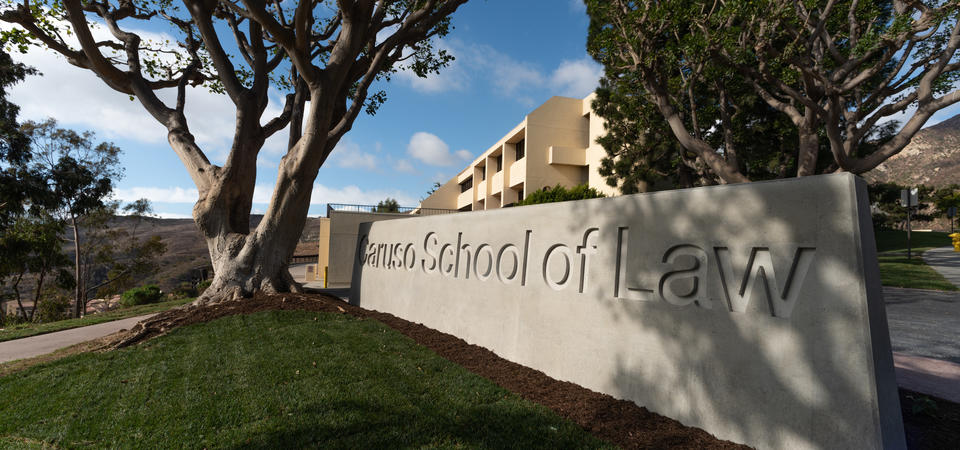 Caruso School of Law concrete sign on a sunny day in Malibu