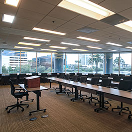 Pepperdine Irvine Campus event space with windows views and table and chairs setup