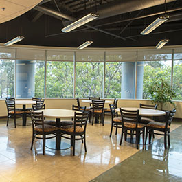 Pepperdine Irvine Campus event space with window views and tables and chairs set up