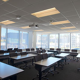 Pepperdine West Los Angeles Campus event space with window views and table and chairs set up