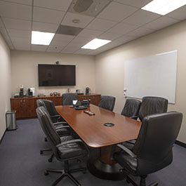 Pepperdine West Los Angeles Campus event space with conference table and wall monitor