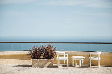bistro furniture set overlooking the ocean