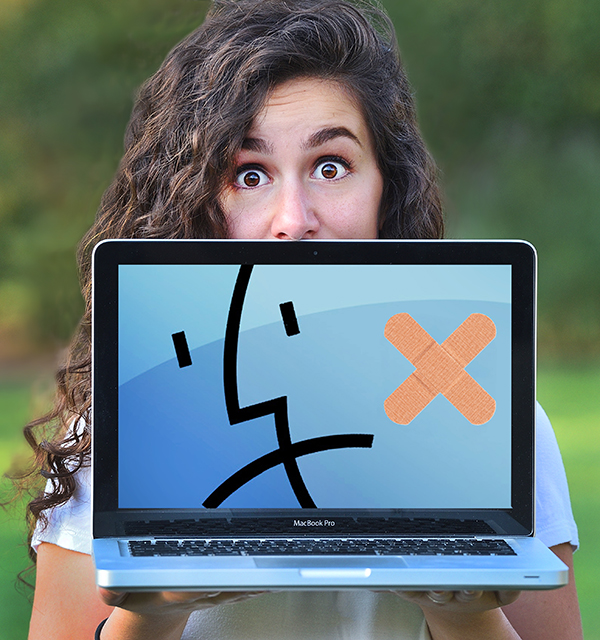 Surprised female student holding broken laptop