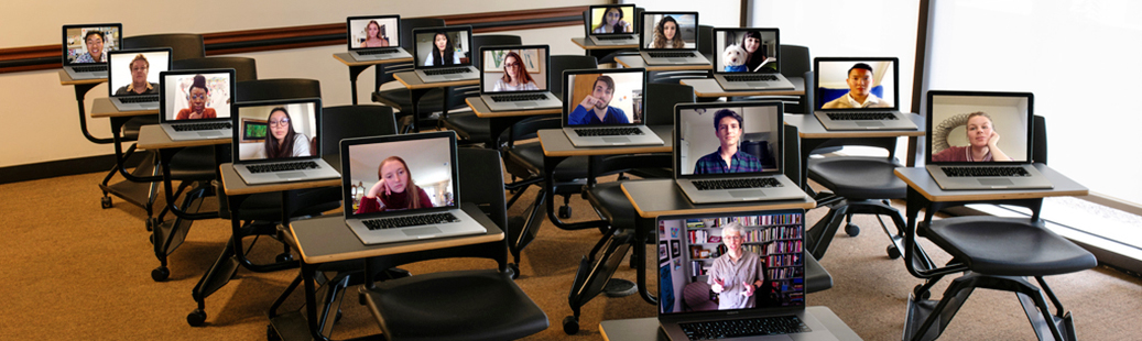 Classroom full of laptops with student faces on each
