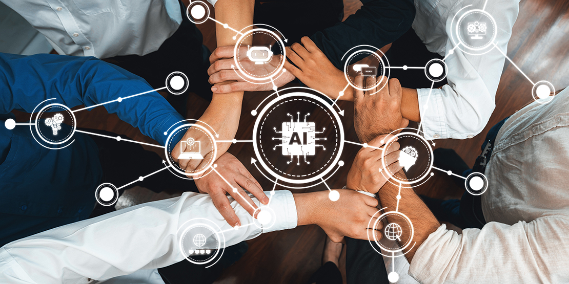 A group of seven office workers form a circle and grasp one another's wrists to symbolize teamwork.