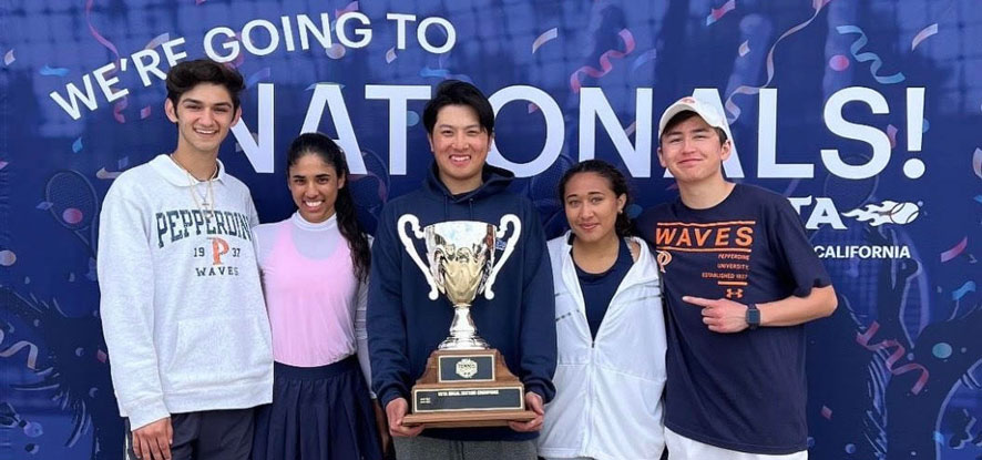 Tennis players holding a trophy