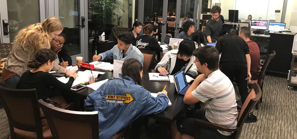 Group of students attending a tutoring session in the library