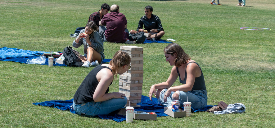 Students playing lawn games at Alumni Park