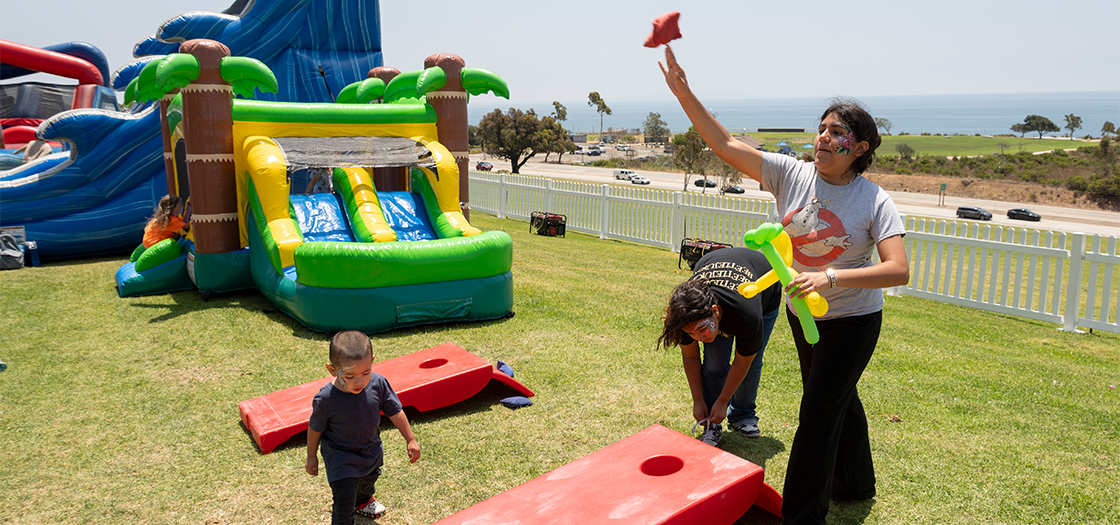 children playing fair games on alumni