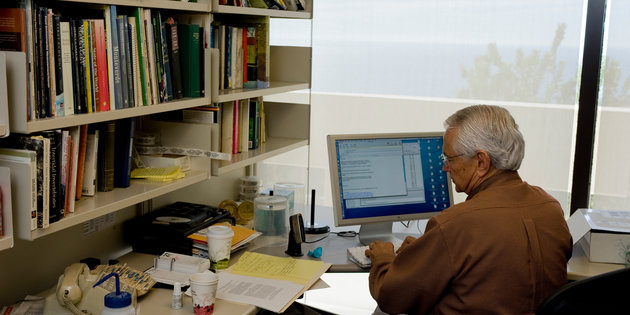 Seaver professor in his office