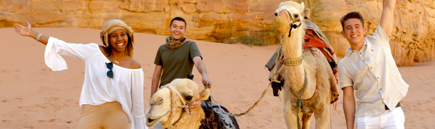 Seaver students alongside camels in Jordan