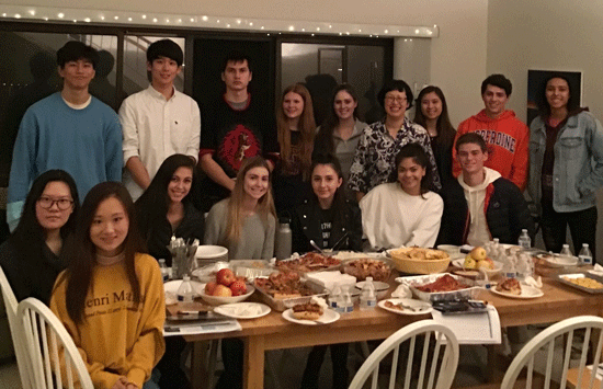 Seaver students dining at a faculty member's house