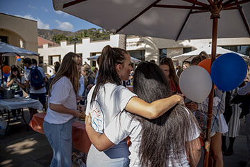 Students hugging at RISE Event