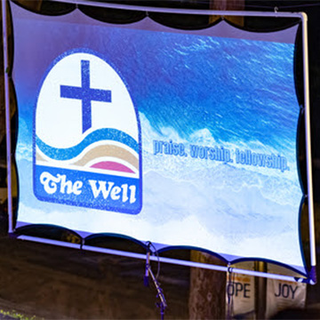 An outdoor screen featuring the Well symbol 