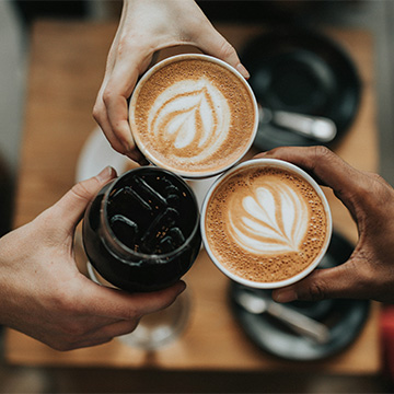 Hands holding coffee