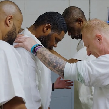 Inmates praying inside Parchman Prison